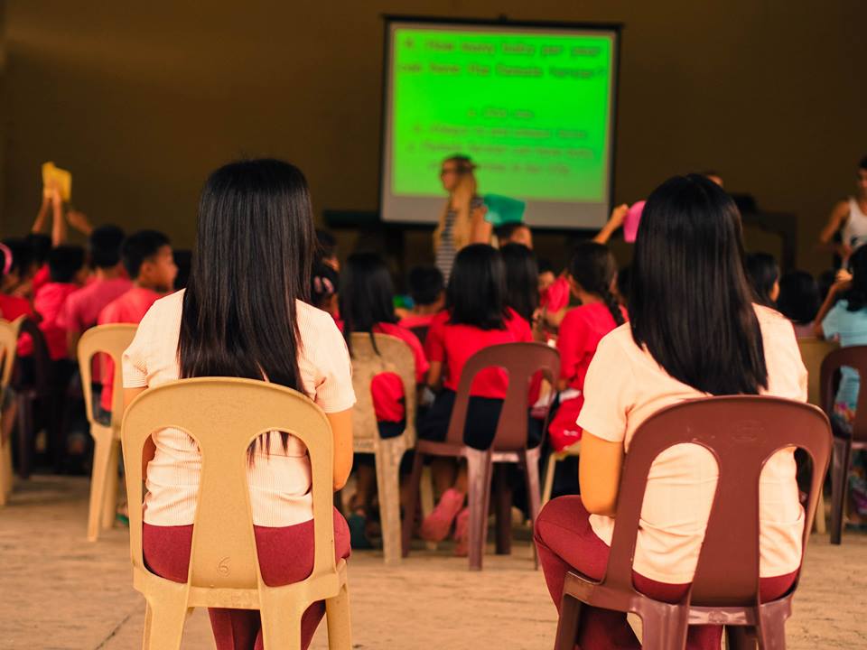Students of Corella National High School listening to one of the volunteers lecture during the Tarsier Educational Campaign
