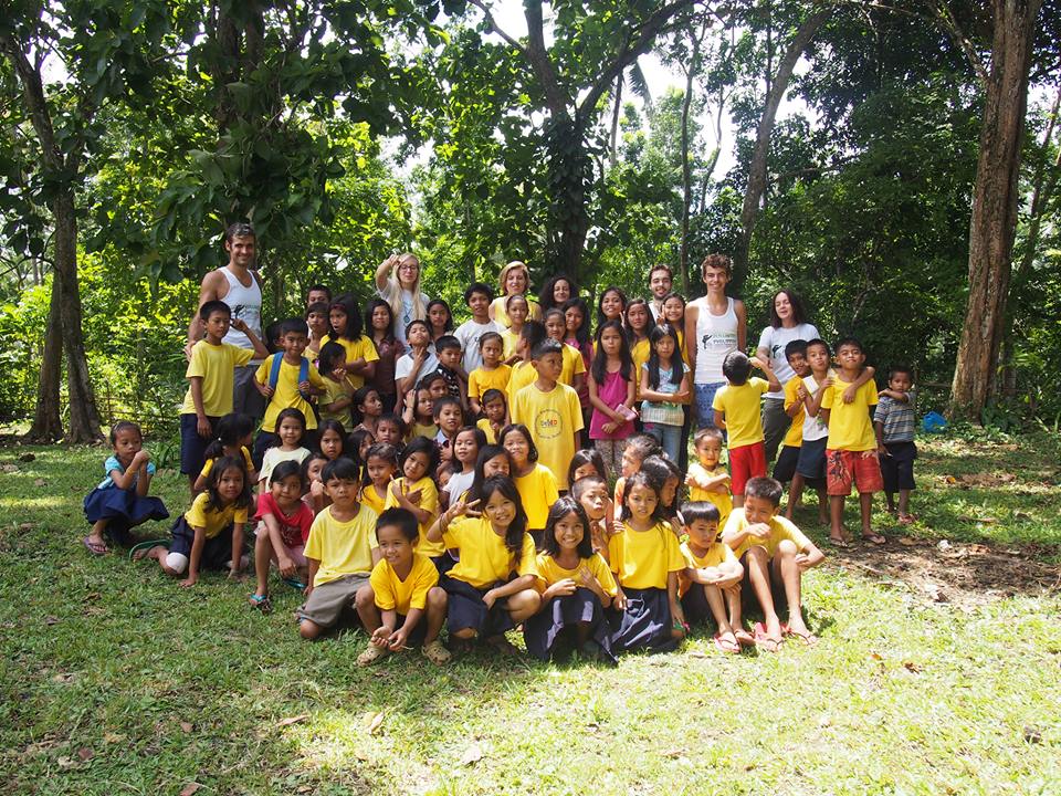Pupil of the Canapnapan Elementary School pose with PTFI volunteers after Tarsier Educational Campaign lecture